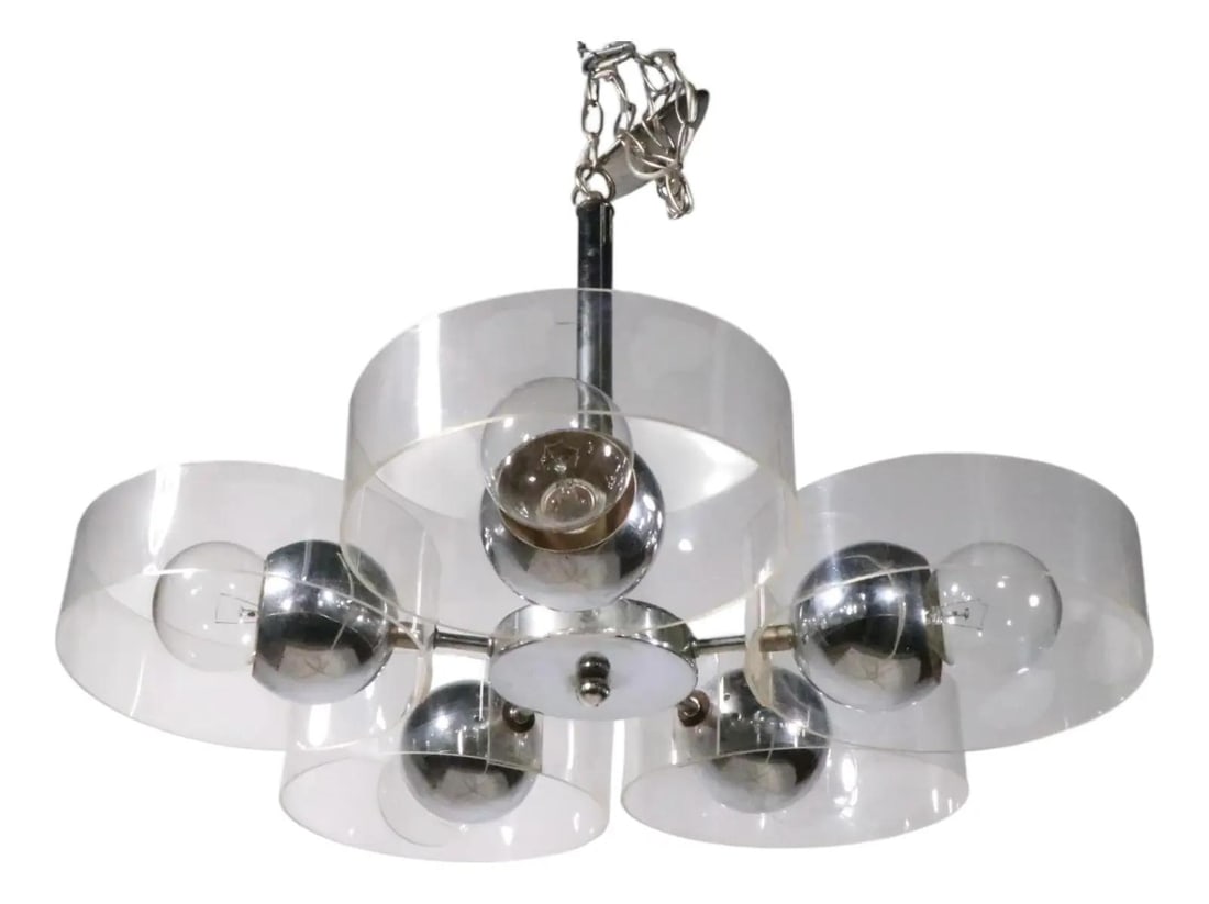 Mid Century Chrome Lucite 5 Arm Chandelier 25x42.5: Mid Century Chrome Lucite 5 Arm Chandelier 25x42.5 Mid Century Space Age chandelier with five chrome arms and ball-form sockets, surrounded by a clear plexi-glass band shade. It accepts standard size 