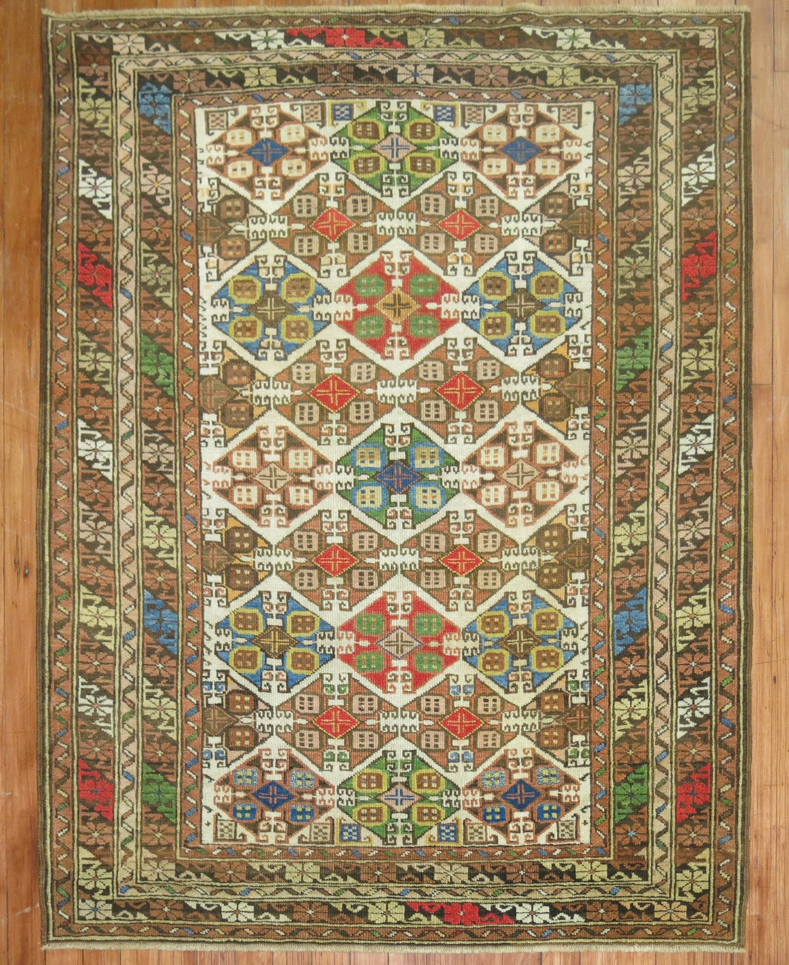 3' 6" x 4' 8" Antique Caucasian Small Square Rug: 3' 6" x 4' 8" Antique Caucasian Small Square Rug Early 20th-century antique Caucasian rug with a colorful design. This pre-owned piece is categorized as a small square rug. Specifications Type: Caucas