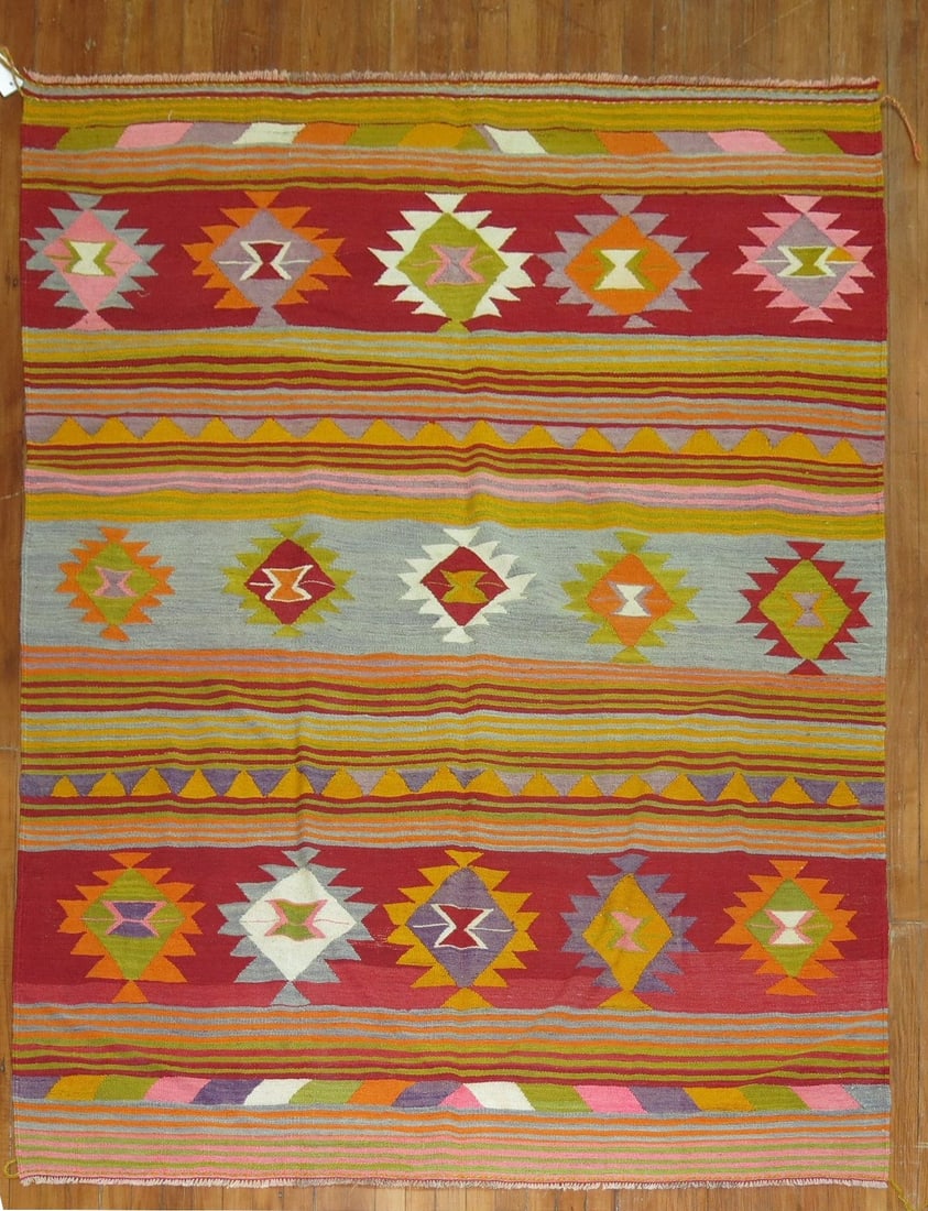 5' 6" x 8' Turkish Vintage Kilim Rug: 5' 6" x 8' Turkish Vintage Kilim Rug Vintage 20th century Turkish kilim featuring jazzy colors. This pre-owned piece offers a lively look while retaining the character of a vintage textile. Specificat