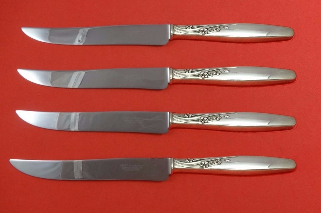 Lunt Summer Song Sterling Silver 4pc Steak Knife Set Texas Sized: Lunt Summer Song Sterling Silver 4pc Steak Knife Set Texas Sized Introducing the Summer Song by Lunt Sterling Silver Steak Knife Set, a remarkable 4-piece collection designed for those who appreciate 