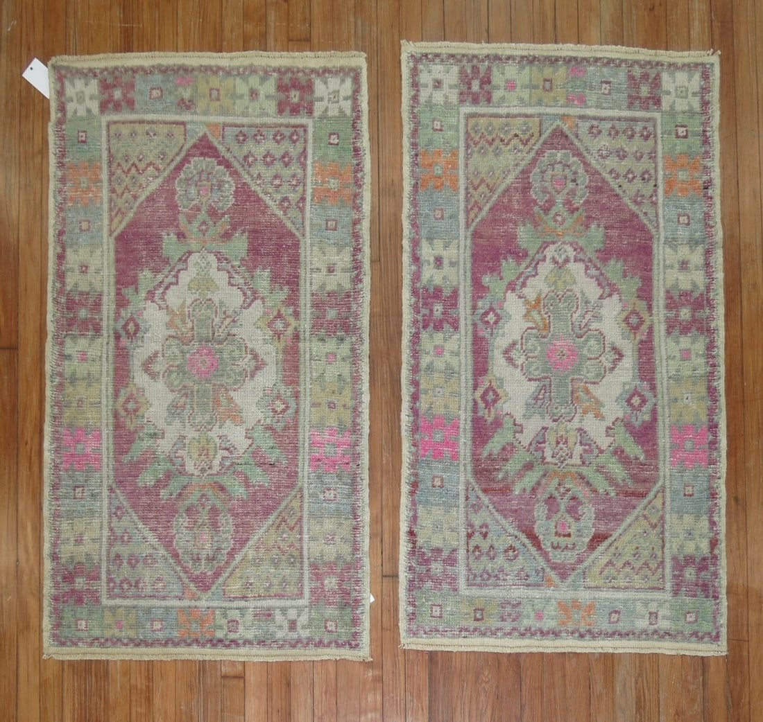 Pair of Anatolian Turkish Rugs in Lavender 2' 9" x 4' 8": Pair of Anatolian Turkish Rugs in Lavender 2' 9" x 4' 8" Pair of mid 20th century Turkish rugs in a lavender colorway. These small Anatolian rugs are offered as a pair and feature traditional patterne