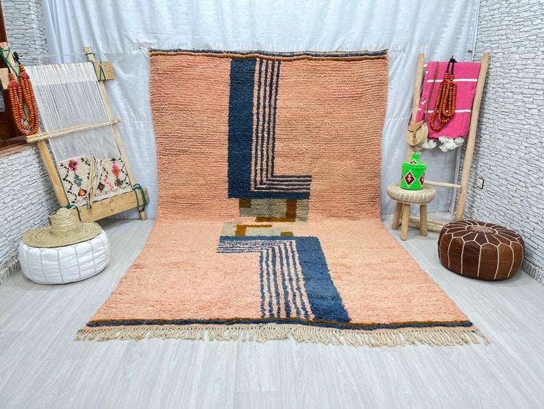 Authentic Handwoven Soft Wool Rug from Morocco 10 x 5 Feet: Authentic Handwoven Soft Wool Rug from Morocco 10 x 5 Feet Enhance your living space with this stunning authentic soft wool rug, handwoven by local Berber women weavers in the Atlas Mountains of Moroc