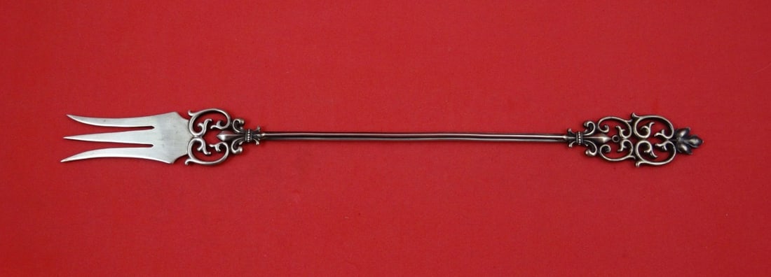 Sterling Silver Serving Fork by Shiebler Maple Leaf Motif 10 1/4 Inch: Sterling Silver Serving Fork by Shiebler Maple Leaf Motif 10 1/4 Inch This Shiebler sterling silver serving fork features a long design with a maple leaf motif. Crafted between 1850 and 1899, it is no