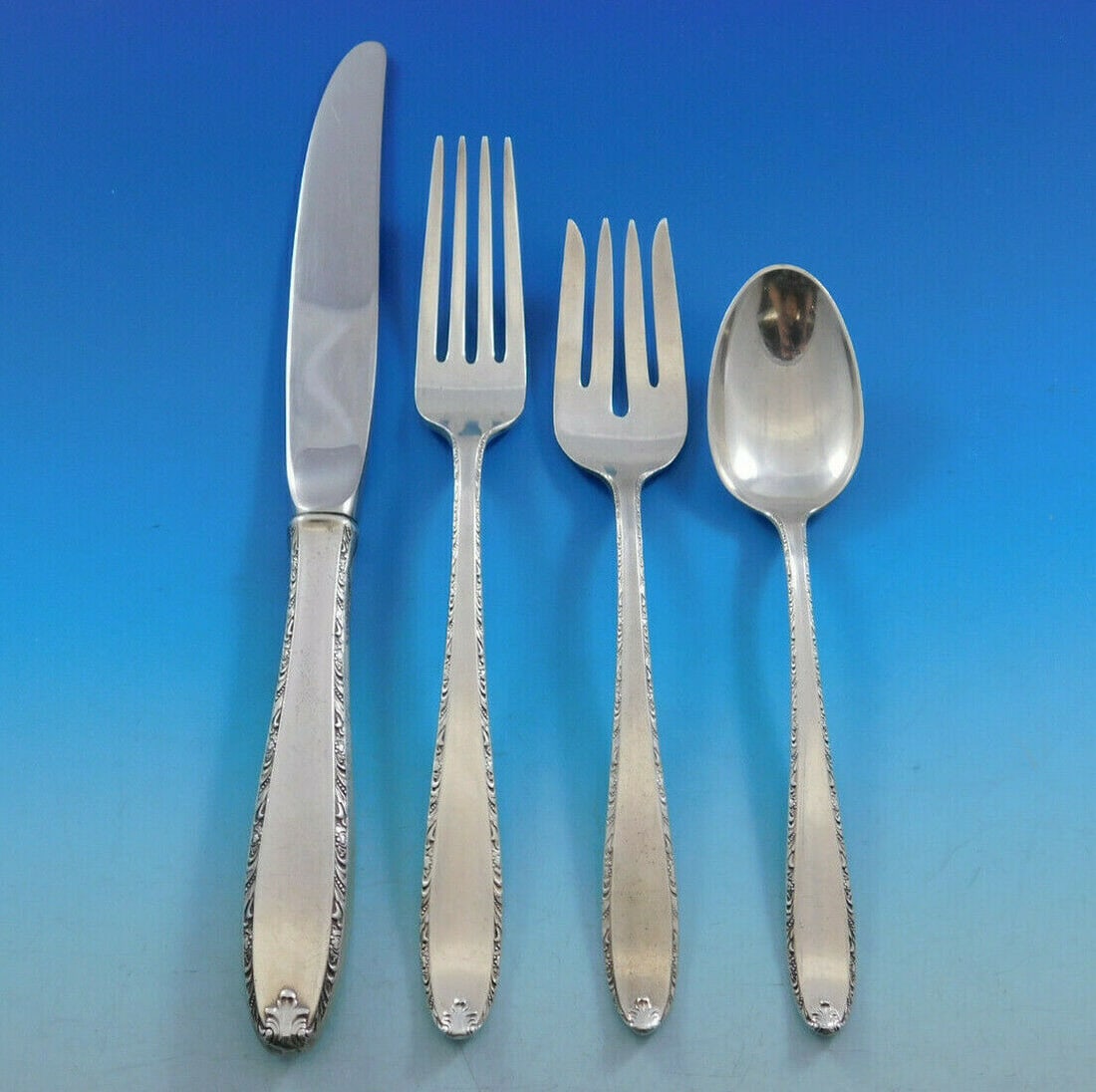 Alvin Southern Charm Sterling Silver 4-Piece Place Setting: Alvin Southern Charm Sterling Silver 4-Piece Place Setting Enhance your dining experience with this exquisite 4-piece place setting from the Southern Charm pattern by Alvin. Crafted from high-quality 