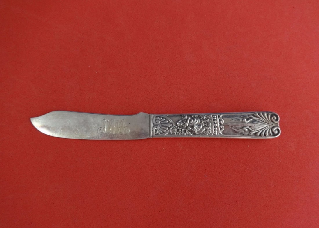 Gorham Number 15 Sterling Silver Butter Spreader Woman and Oxen 6": Gorham Number 15 Sterling Silver Butter Spreader Woman and Oxen 6" A Gorham sterling silver butter spreader in the Number 15 pattern, featuring a flat handle with a woman and oxen design. It is monogr
