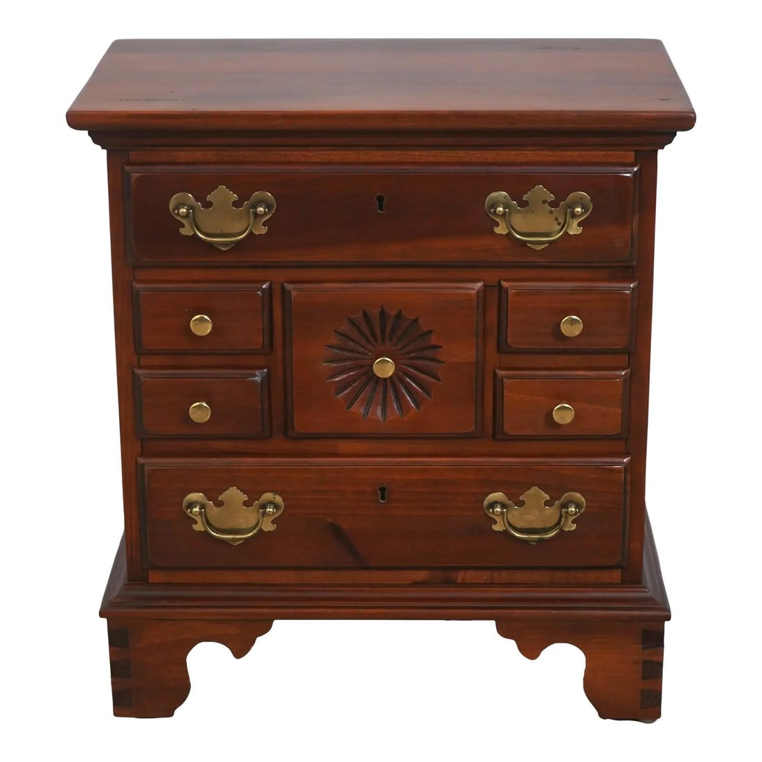 7 Drawer Pine Nightstand with Brass Hardware 20w x 12d x 22h: 7 Drawer Pine Nightstand with Brass Hardware 20w x 12d x 22h Vintage country pine chest/nightstand with 7 drawers, featuring factory distressed finish, dovetailed feet, sunburst carving, bracket feet,