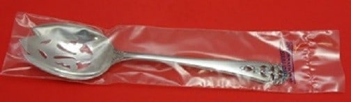 International Sterling Silver Queen's Lace Slotted Serving Spoon 8.5 Inch: International Sterling Silver Queen's Lace Slotted Serving Spoon 8.5 Inch This exquisite serving spoon features the elegant Queen's Lace pattern by International Silver, crafted from high-quality ster