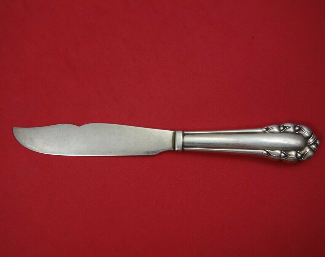Georg Jensen Lily of the Valley Sterling Silver Fish Knife 7.5": Georg Jensen Lily of the Valley Sterling Silver Fish Knife 7.5" This exquisite fish knife is part of the iconic Lily of the Valley pattern by Georg Jensen. Crafted from high-quality sterling silver, t