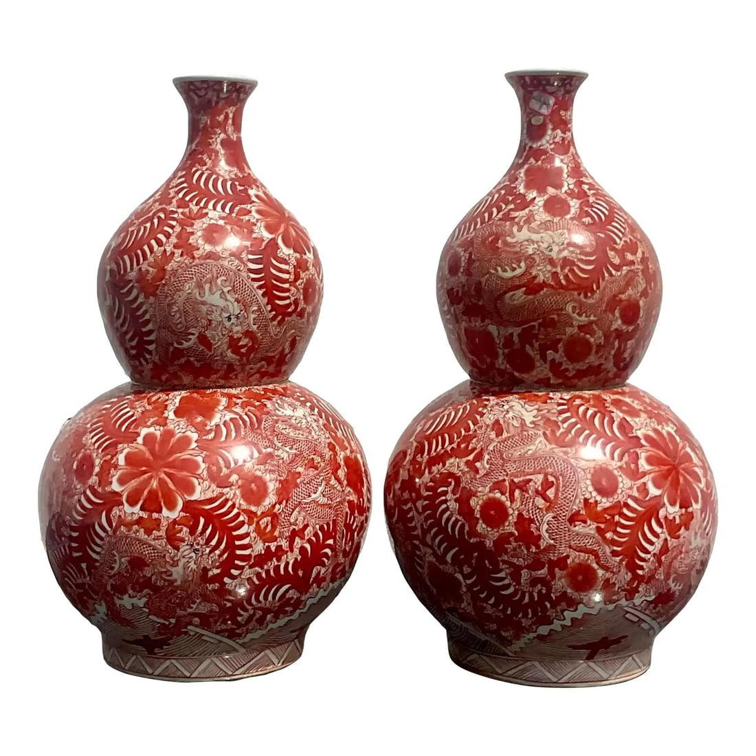 Pair of Vintage Asian Red Glazed Ceramic Double Gourd Lamps: Pair of Vintage Asian Red Glazed Ceramic Double Gourd Lamps This stunning pair of vintage Asian glazed ceramic double gourd lamps features a striking red finish adorned with intricate details of drago