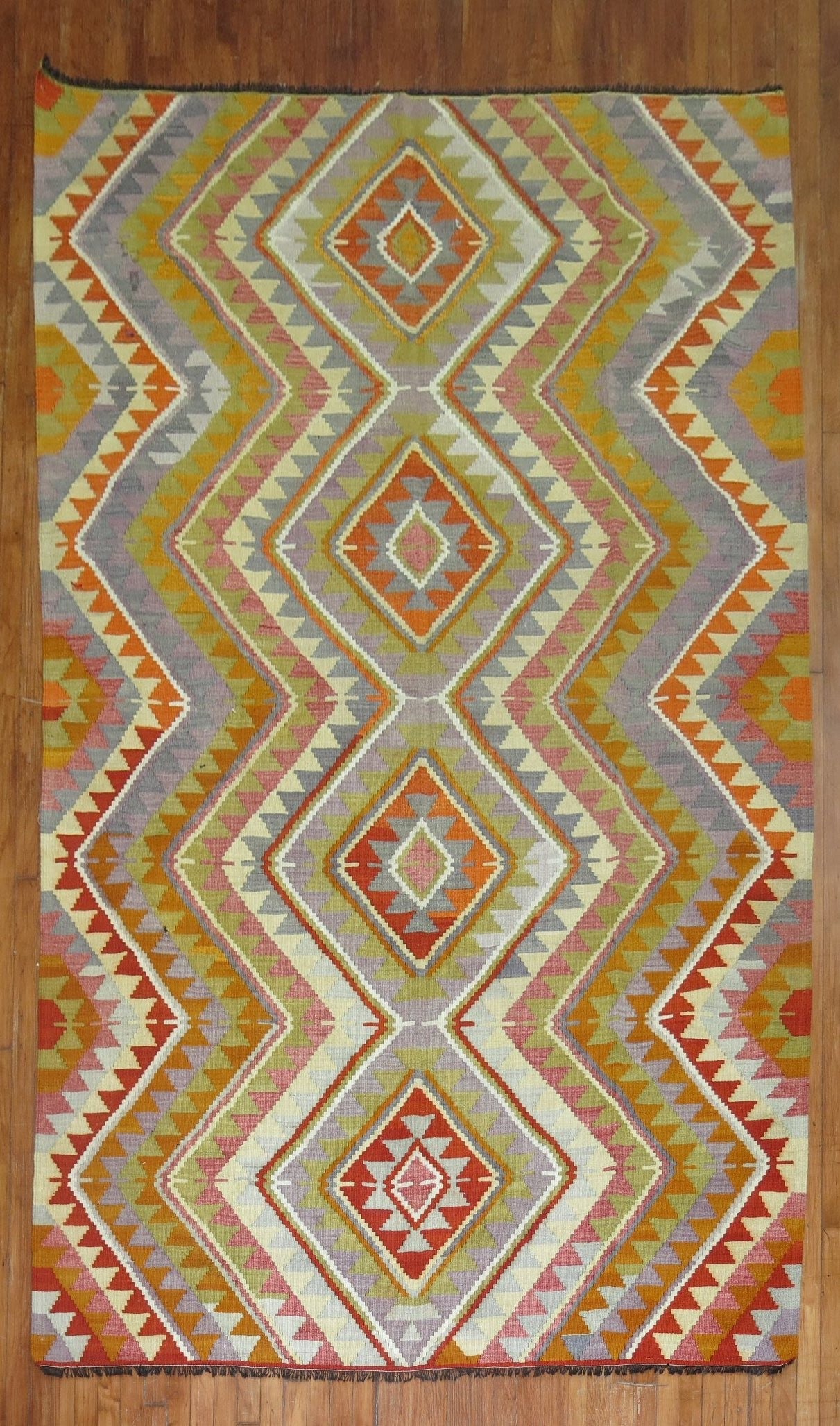 6' 4" x 10' 5" Geometric Turkish Kilim Rug Vintage: 6' 4" x 10' 5" Geometric Turkish Kilim Rug Vintage Vintage Turkish kilim with a geometric design from the 3rd quarter of the 20th century. This pre-owned rug features a colorful pattern consistent wit
