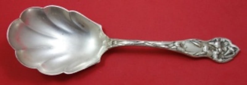 Sterling Silver Fluted Berry Spoon in Lily Pattern 9 Inch: Sterling Silver Fluted Berry Spoon in Lily Pattern 9 Inch This is a Watson sterling silver berry spoon featuring a fluted design in the Lily pattern. The spoon measures 9 inches in length and dates fr