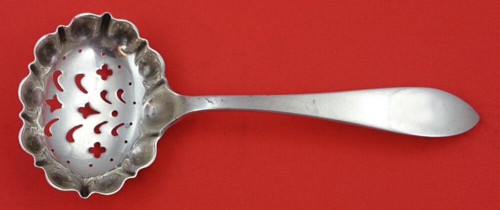 Tiffany & Co. Queen Anne Sterling Silver Sugar Sifter Spoon 6 1/4 in: Tiffany & Co. Queen Anne Sterling Silver Sugar Sifter Spoon 6 1/4 in This exquisite sugar sifter from Tiffany & Co. features the elegant Queen Anne pattern and is crafted from high-quality sterling si