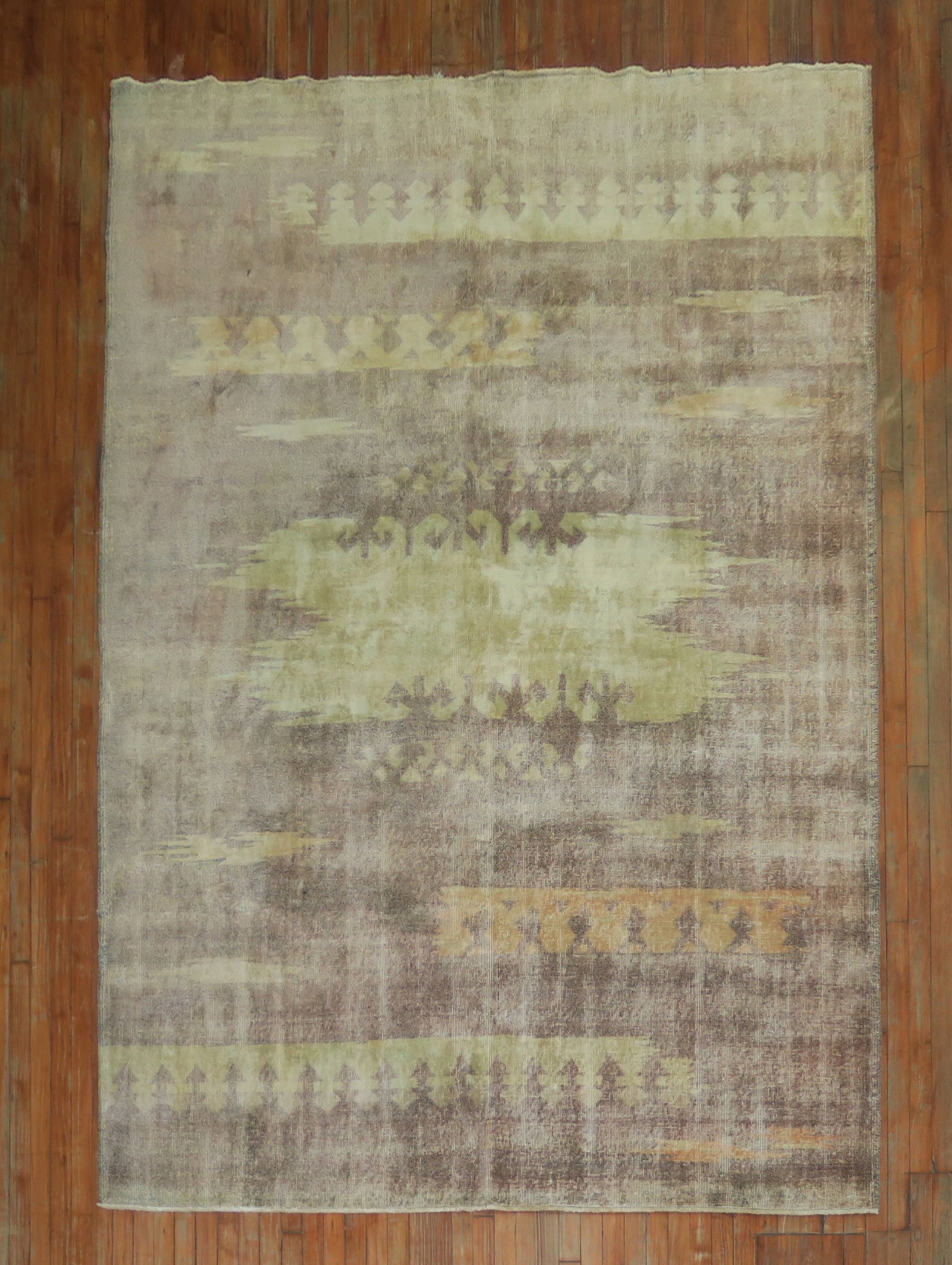 7' x 9' 10" Turkish Inspired Deco Room Rug Lavender Ground: 7' x 9' 10" Turkish Inspired Deco Room Rug Lavender Ground Mid-20th century Turkish inspired Deco rug featuring cantaloupe and mint accents on a lavender ground. This pre-owned piece is described as A