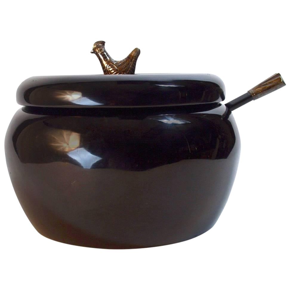 Danish Wood Lacquered Serving Bowl with Bird Finial: Danish Wood Lacquered Serving Bowl with Bird Finial This exquisite lacquered serving bowl features a striking ink blue finish and is adorned with a silver-plated bird finial. Crafted from wood, it exu