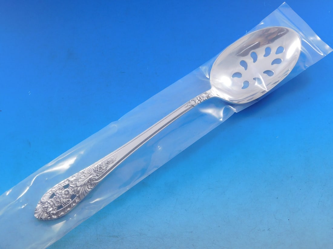 International Silver Crown Princess 9 Hole Sterling Slotted Spoon 8 1/2: International Silver Crown Princess 9 Hole Sterling Slotted Spoon 8 1/2 This is a pierced serving spoon in the Crown Princess pattern by International Silver. Crafted from sterling silver, this slotte