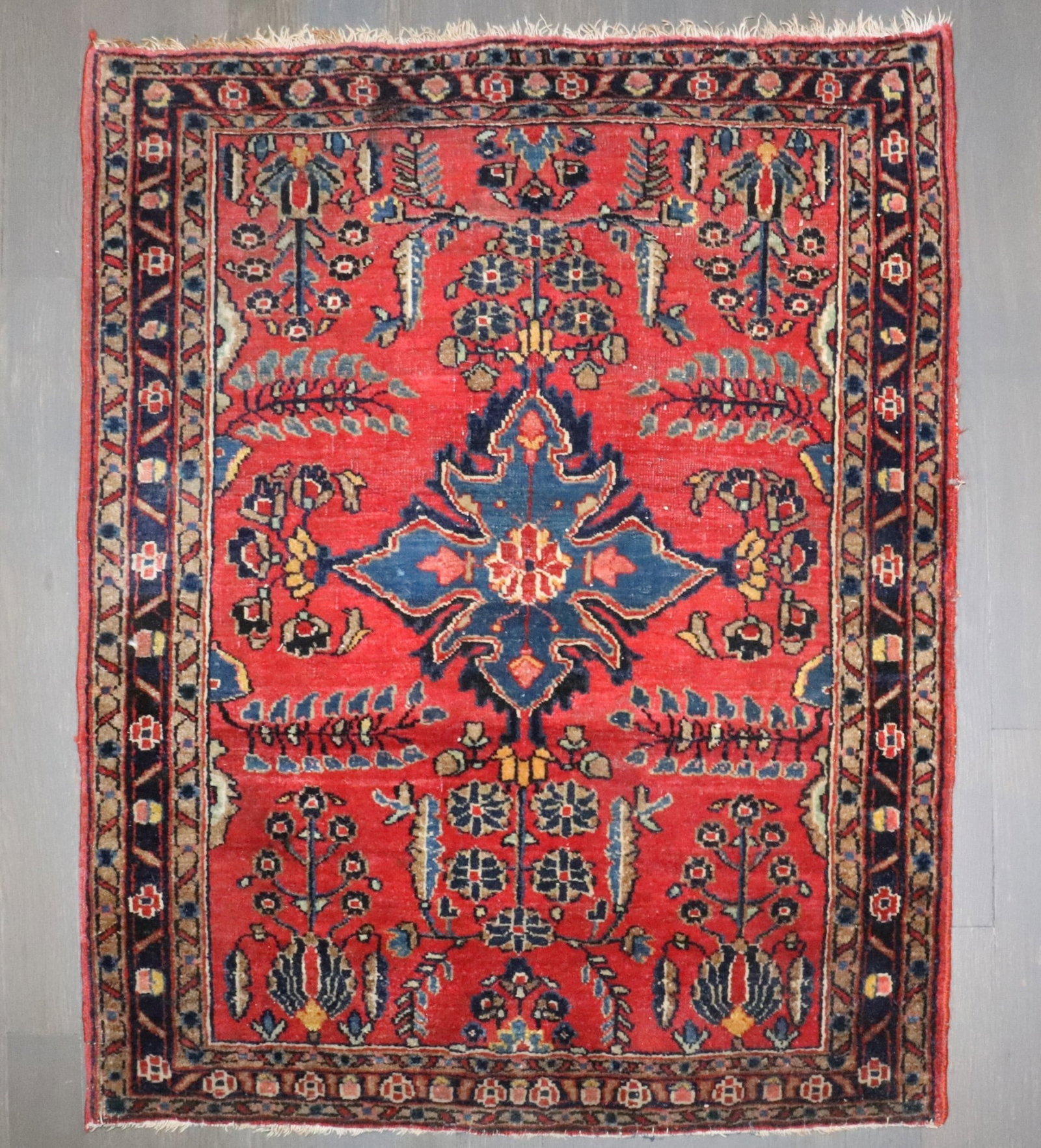 2' 2" x 2' 7" Square Persian Sarouk Rug Red Blue: 2' 2" x 2' 7" Square Persian Sarouk Rug Red Blue Pre-owned 1930s Persian Sarouk mini square rug with a red field and an intricate floral design. This piece is identified as a Sarouk and categorized as