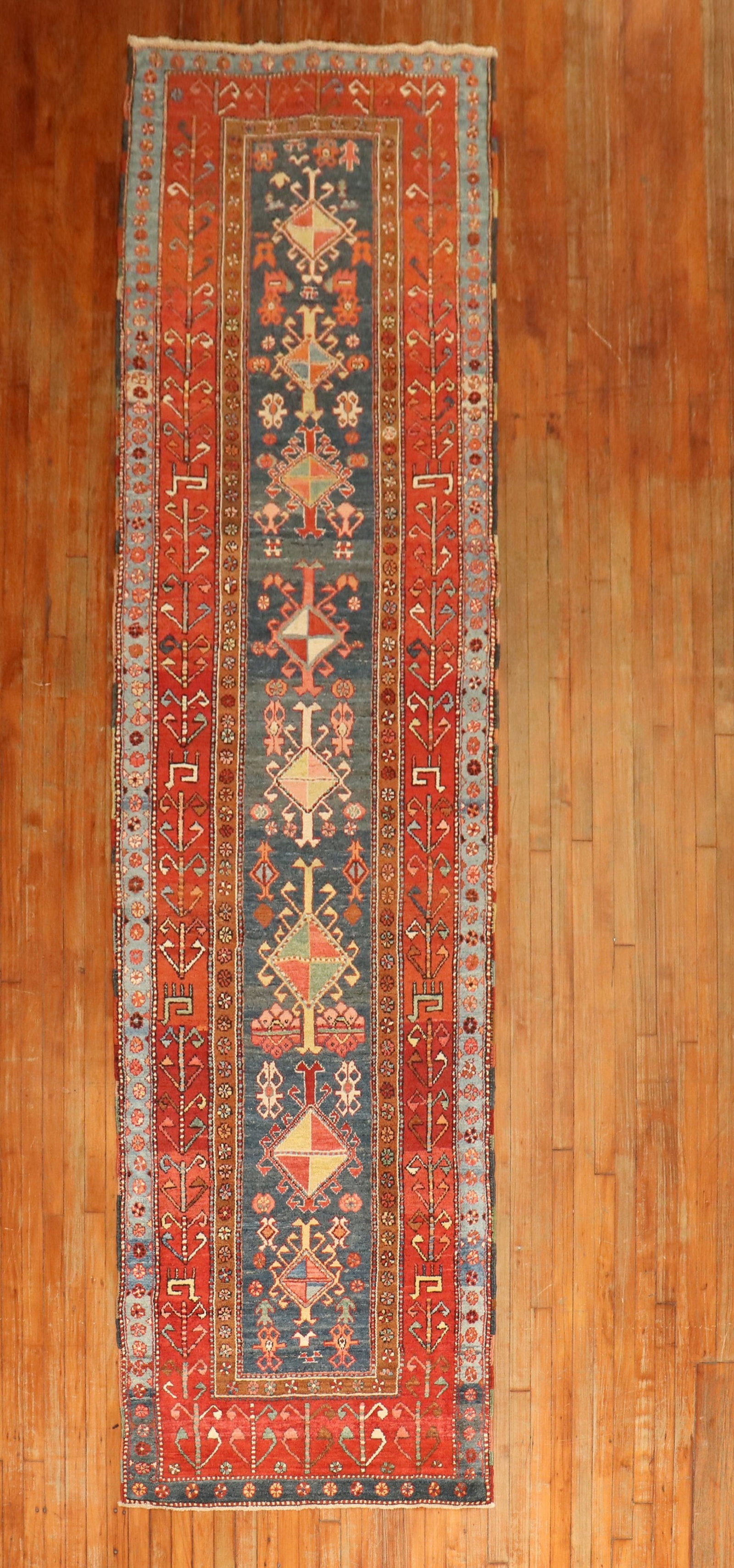 3' 5" x 13' 5" Antique Persian Heriz Serapi Rug Runner: 3' 5" x 13' 5" Antique Persian Heriz Serapi Rug Runner Antique Persian Serapi runner from the early 20th century, featuring a navy blue field framed by a wide tribal red border. This pre-owned runner 