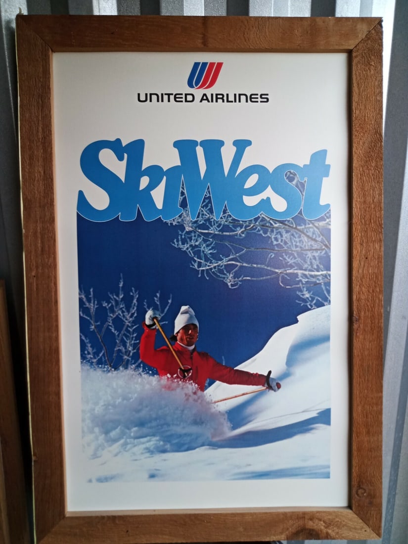 1975 United Air Lines Ski West travel poster in rustic frame: 1975 United Air Lines Ski West travel poster in rustic frame Original vintage 1975 United Air Lines "Ski West" travel poster, presented in a rustic wooden frame. This pre-owned poster is bright and li