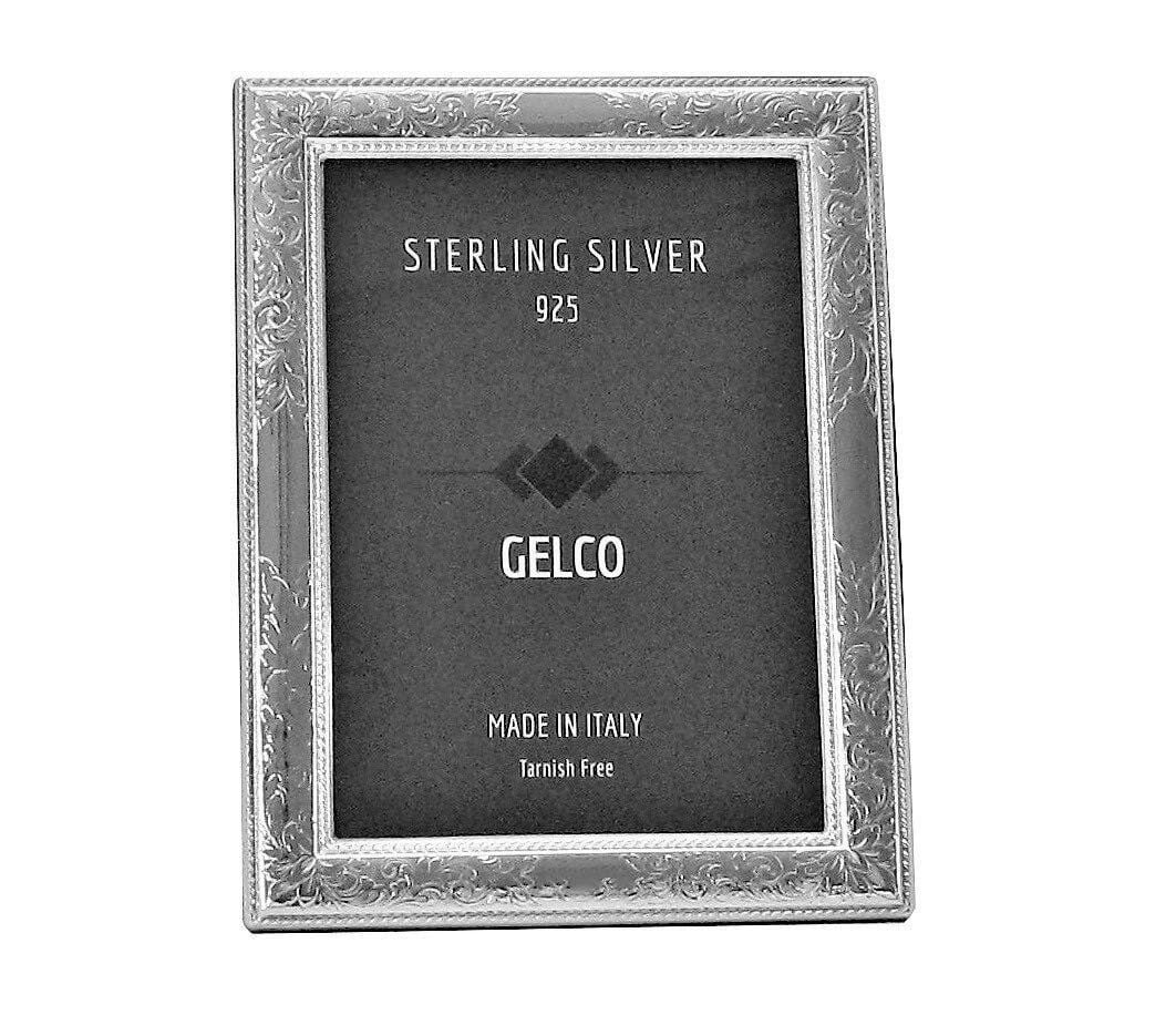 Hand Chased Italian 925 Silver Floral Photo Frame by GELCO: Hand Chased Italian 925 Silver Floral Photo Frame by GELCO This Italian picture frame is crafted from 925 sterling silver and features a hand-chased glossy floral design. It is designed to hold photog