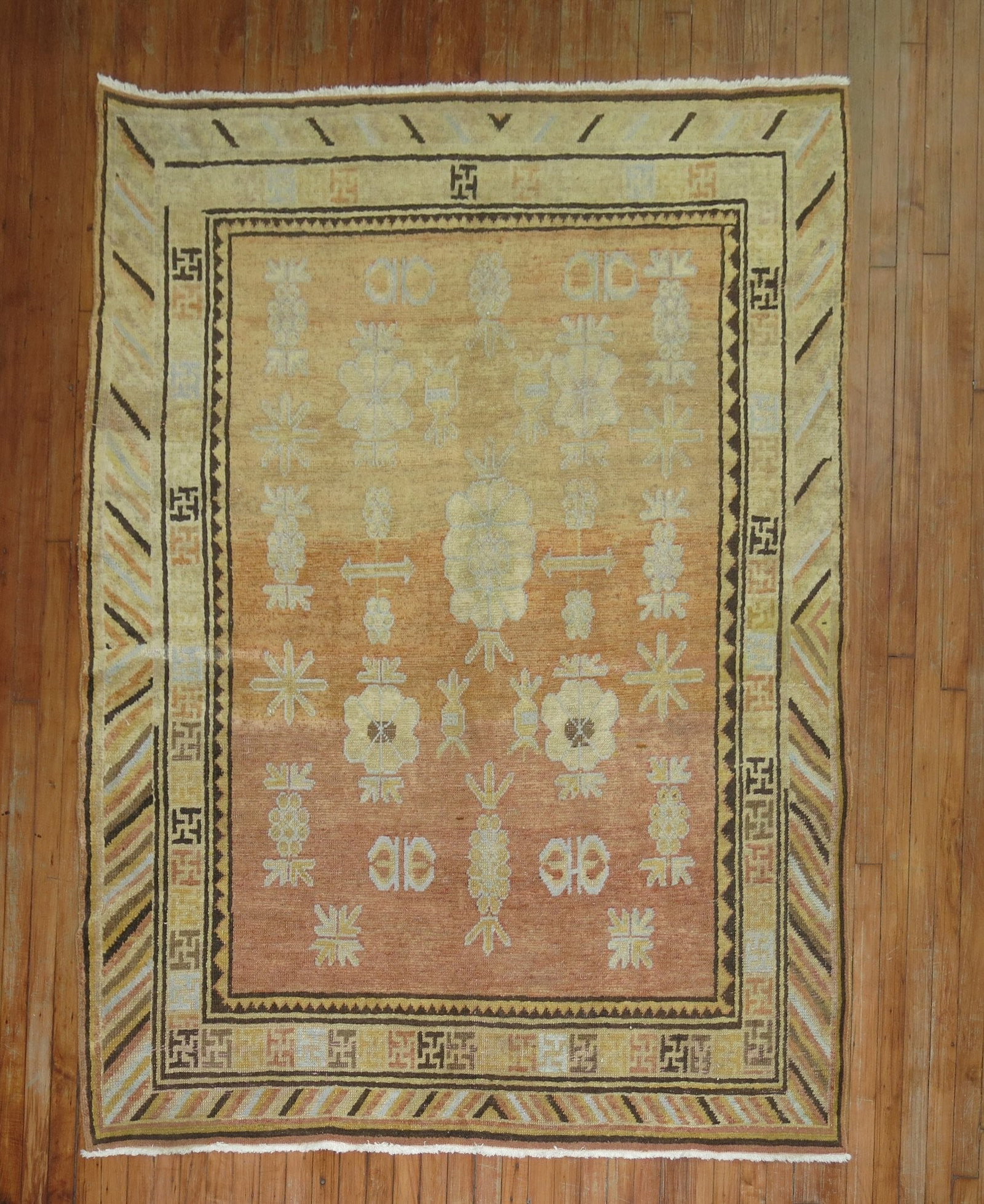 5' 6" x 7' 3" Early 20th Century Khotan Area Rug: 5' 6" x 7' 3" Early 20th Century Khotan Area Rug Antique Khotan rug from the early 20th century with a classic rectangular form. This pre-owned piece is identified as an intermediate, square category 