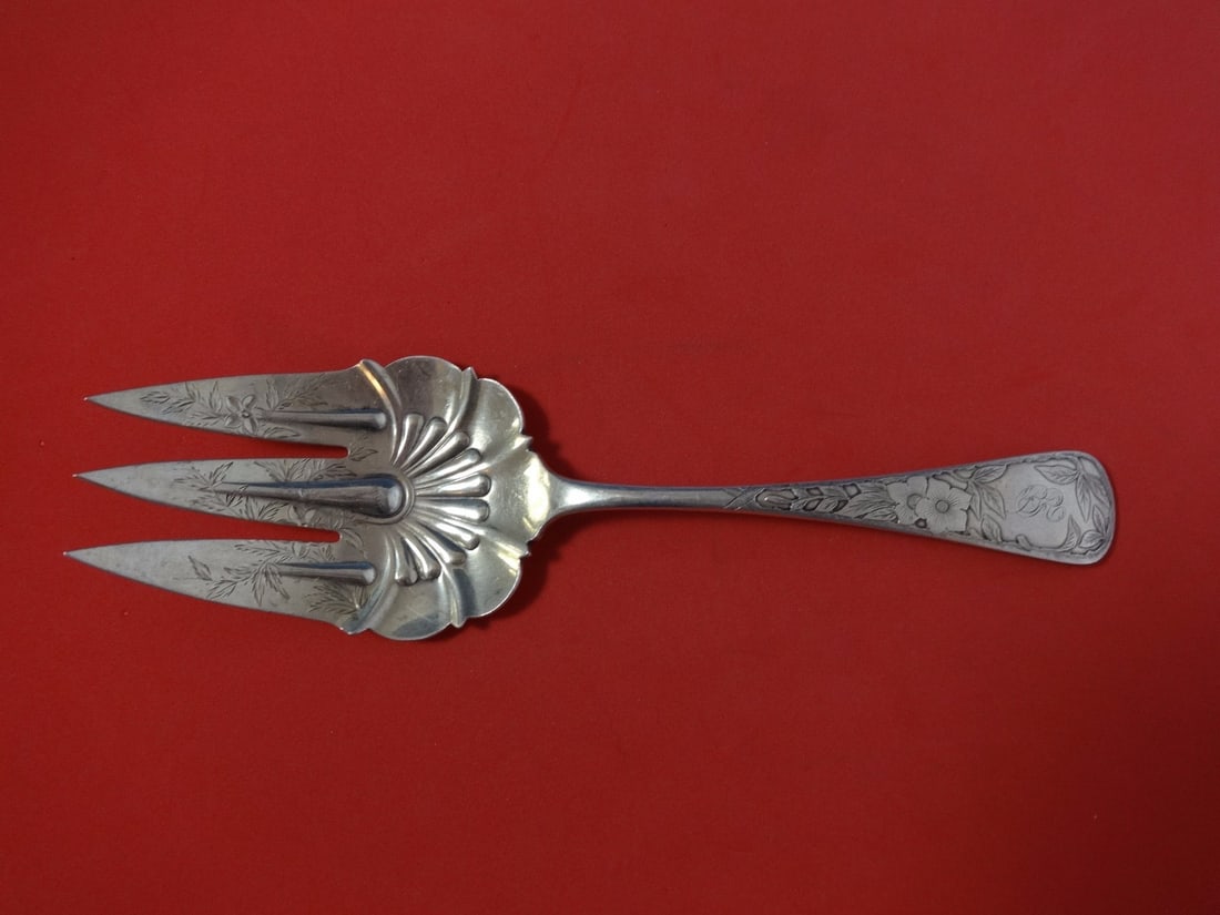 Gorham Clematis sterling silver salad serving fork bright cut 8 5/8: Gorham Clematis sterling silver salad serving fork bright cut 8 5/8 Sterling silver salad serving fork in the Clematis pattern by Gorham, featuring bright-cut decoration and floral engravings on the h