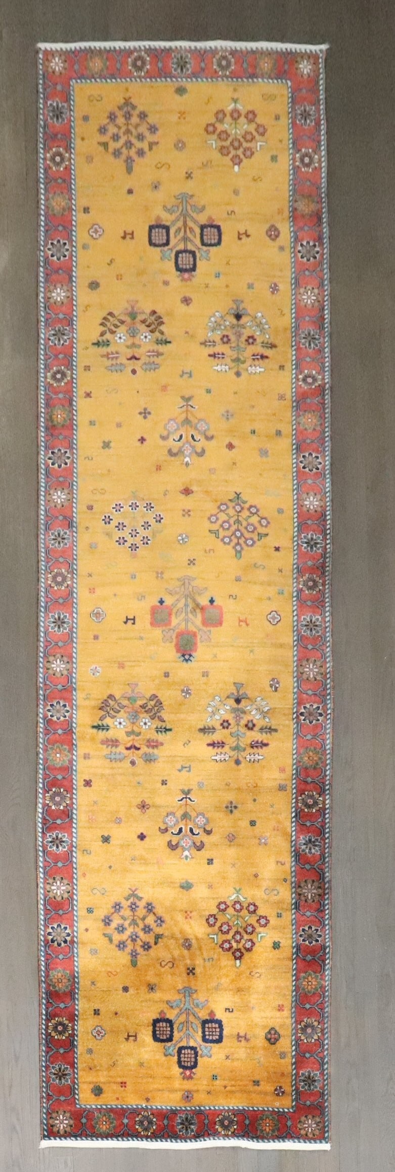 2' 8" x 9' 8" Mustard Persian Gabbeh Repro Runner: 2' 8" x 9' 8" Mustard Persian Gabbeh Repro Runner Vintage-inspired Persian Gabbeh runner in a mustard colorway. This pre-owned reproduction piece offers the look of a traditional Persian runner with a