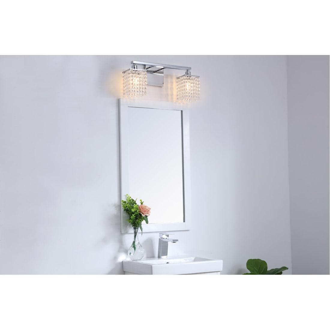 Phineas Chrome Crystal 2-Light Wall Sconce 18 Inch: Phineas Chrome Crystal 2-Light Wall Sconce 18 Inch This modern wall sconce features a polished chrome finish and royal cut clear crystals, offering a glamorous accent for any indoor space. Designed fo