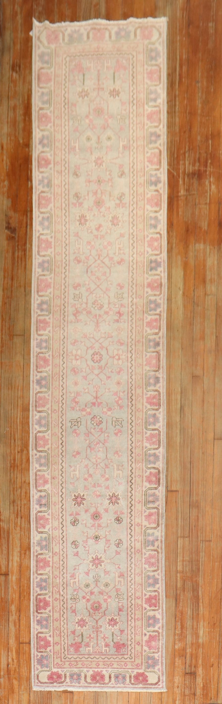 2' 3" x 11' 6" 1930s Khotan runner in green and pink: 2' 3" x 11' 6" 1930s Khotan runner in green and pink Vintage 1930s Khotan runner in a narrow format, featuring green and pink tones. This pre-owned rug is categorized as a runner and identified as a K