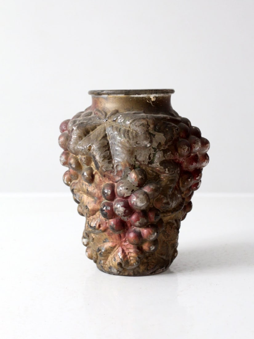 Antique Goofus Glass Vase Vintage Grape Relief 7.25 Inch: Antique Goofus Glass Vase Vintage Grape Relief 7.25 Inch This vintage Goofus glass vase features intricate raised grape clusters and scrolling leaves, creating a rich textured surface adorned with shi