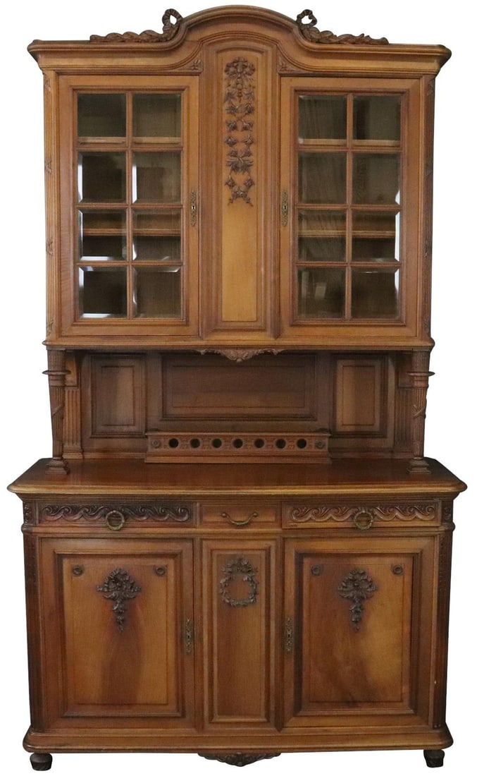 Louis XVI Style Walnut Buffet with Glass Doors Chestnut Finish 1900: Louis XVI Style Walnut Buffet with Glass Doors Chestnut Finish 1900 This elegant Louis XVI style buffet, crafted from walnut veneer, showcases intricate carvings and features glass doors, adding a tou