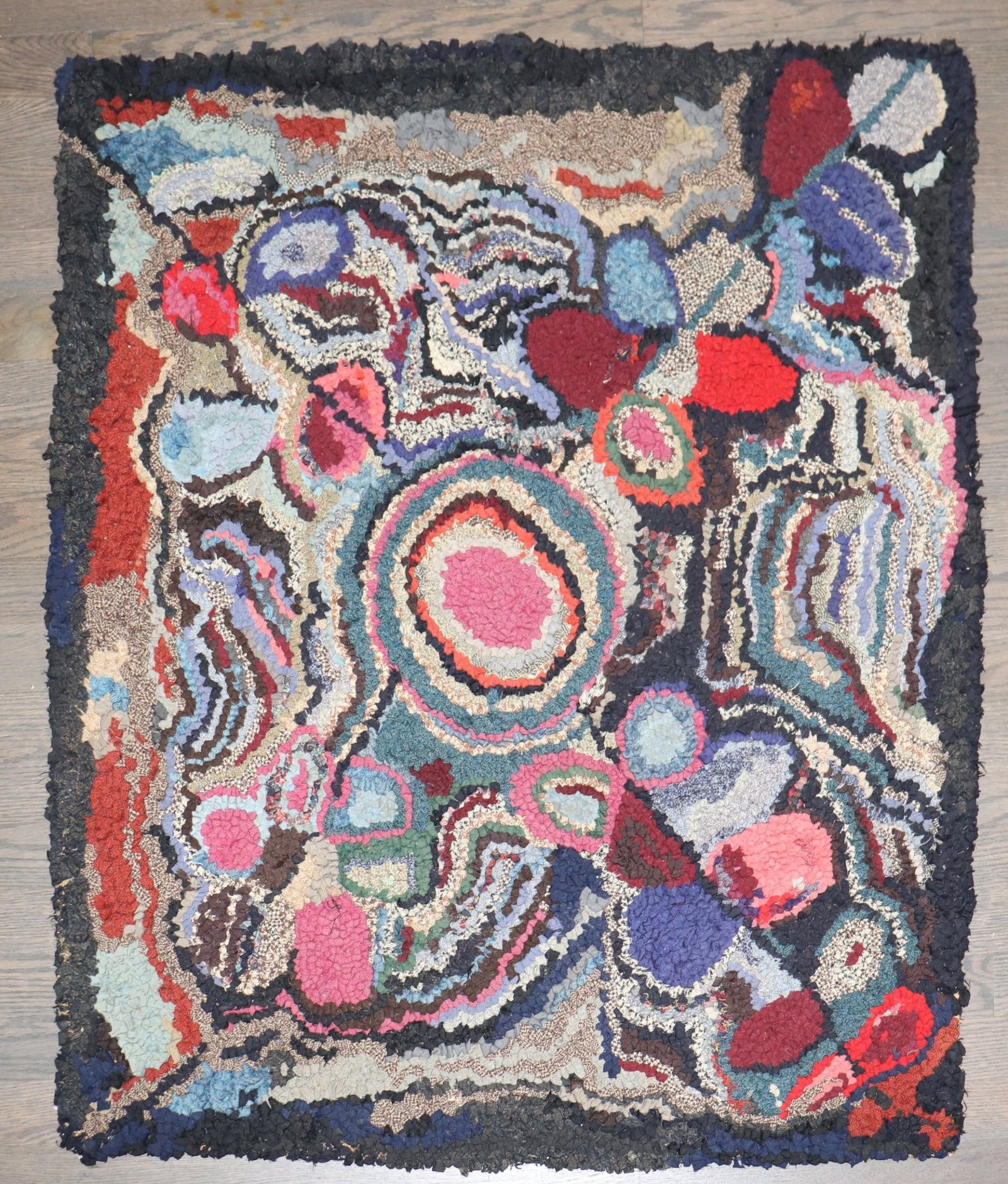 2' 10" x 3' 2" American hooked floral square rug: 2' 10" x 3' 2" American hooked floral square rug Early 20th-century American hooked small square rug with a colorful floral design. This pre-owned piece is categorized as a square yastik. Specificatio