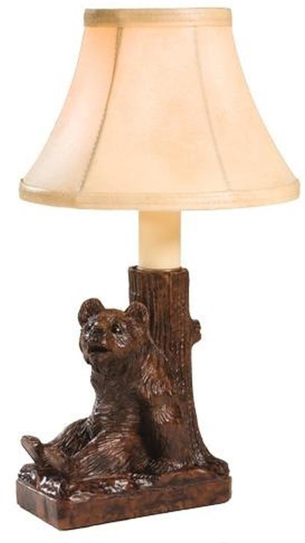 Rustic Lodge Style Hand-Cast Bear Table Lamp with Faux Leather Shade: Rustic Lodge Style Hand-Cast Bear Table Lamp with Faux Leather Shade This item is made at time of order. Please allow 42 to 70 days for production. Illuminate your space with this charming hand-cast b