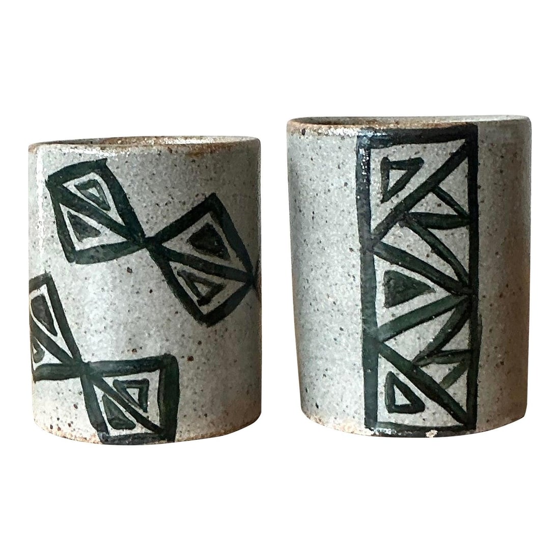Pair of Handcrafted Studio Pottery Tumblers with Geometric Boho Motifs Set of 2: Pair of Handcrafted Studio Pottery Tumblers with Geometric Boho Motifs Set of 2 This set of two vintage studio pottery cups showcases hand-thrown stoneware with a speckled, pale gray glaze. Each cup f