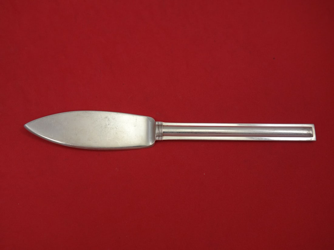 Puiforcat Cannes Sterling Silver Fish Knife 8 Inch Flat Handle: Puiforcat Cannes Sterling Silver Fish Knife 8 Inch Flat Handle Elevate your dining experience with the Cannes by Puiforcat Sterling Silver Fish Knife. This exquisite 8" knife features an all-sterling 