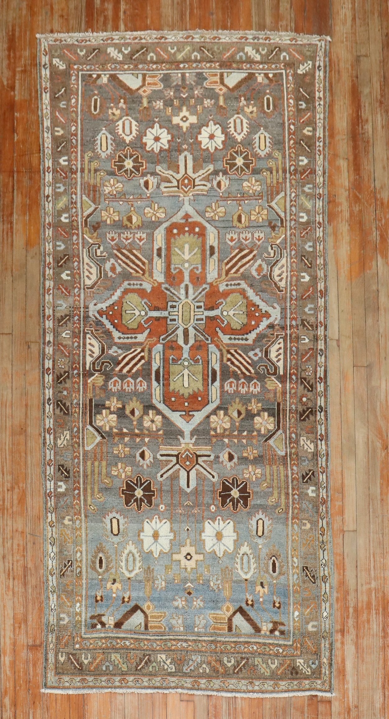 4' x 8' 9" 1930s Persian Malayer rug with central medallion: 4' x 8' 9" 1930s Persian Malayer rug with central medallion Vintage 1930s Persian Malayer rug featuring a central medallion set on a striated earth-tone field. This pre-owned rug presents the classic 