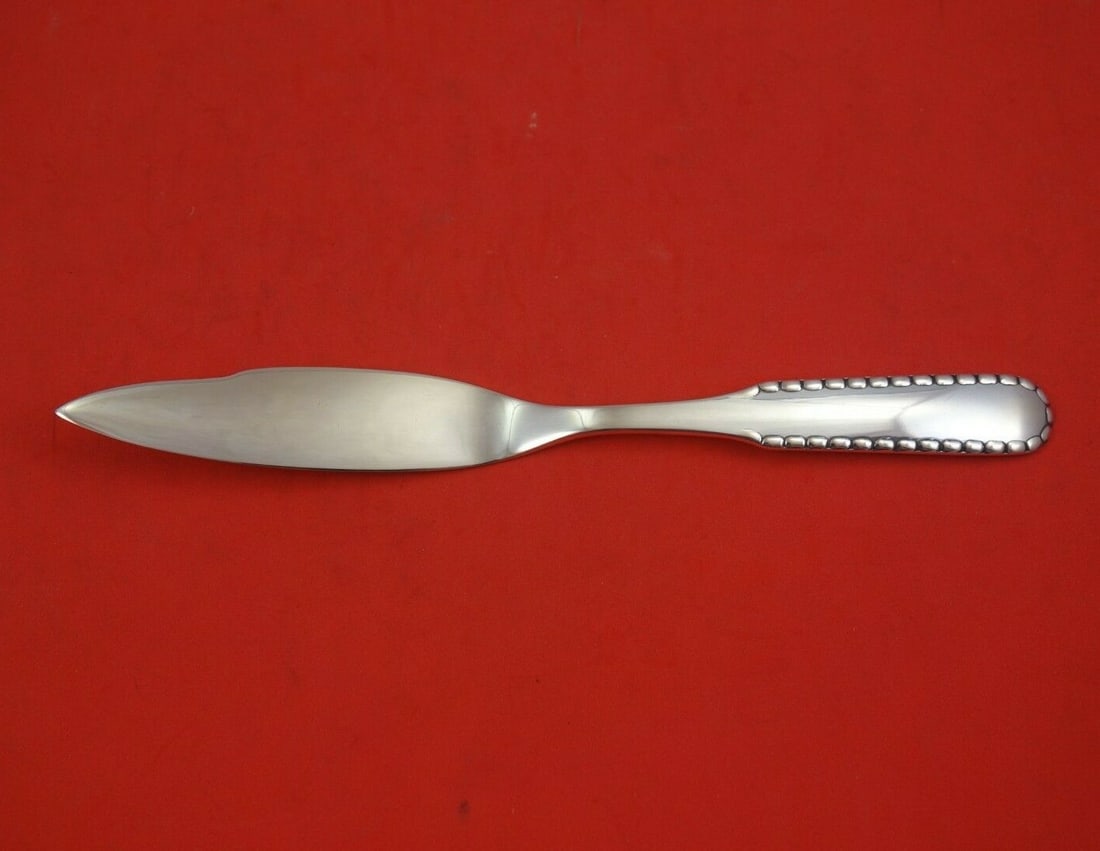 Georg Jensen Rope Sterling Silver Fish Knife 7.5 Inches: Georg Jensen Rope Sterling Silver Fish Knife 7.5 Inches This exquisite fish knife from the esteemed Georg Jensen showcases the iconic Rope pattern, crafted from high-quality sterling silver. The knife
