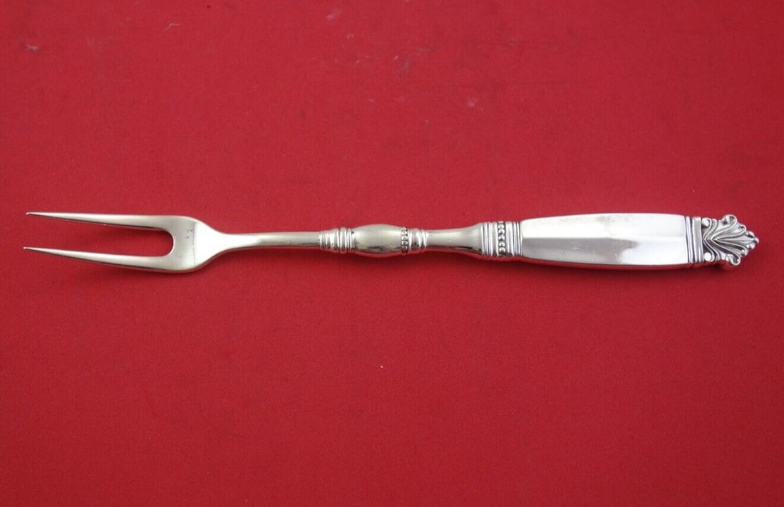 Georg Jensen Acanthus Sterling Silver 2-Tine Cold Meat Fork 8 7/8": Georg Jensen Acanthus Sterling Silver 2-Tine Cold Meat Fork 8 7/8" This exquisite cold meat fork features the elegant Acanthus pattern by Georg Jensen. Crafted from high-quality sterling silver, this 
