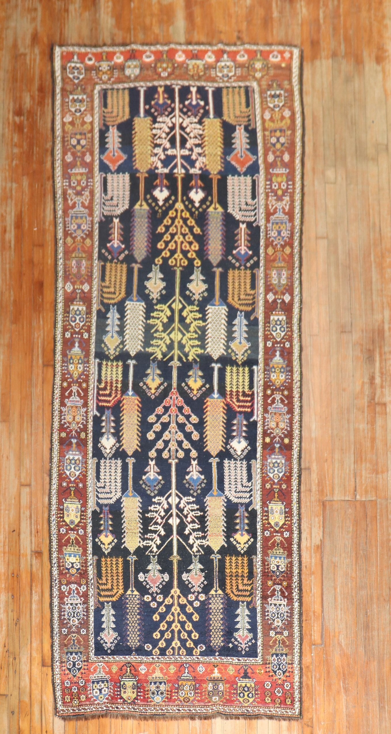 4' 4" x 12' Persian Kurd Bakhtiari Runner Willow Tree Design: 4' 4" x 12' Persian Kurd Bakhtiari Runner Willow Tree Design Early 20th-century Persian tribal runner rug with a willow tree design on a navy ground. This pre-owned Bakhtiari and Kurd rug is categoriz