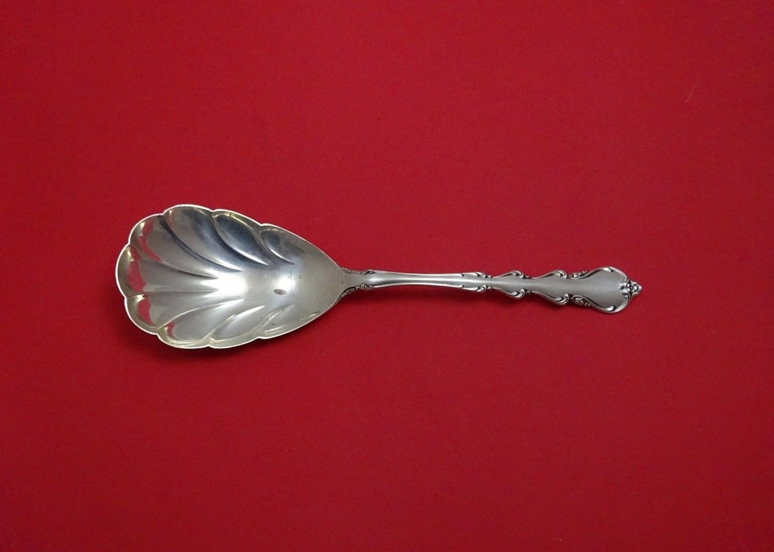 International Angelique Sterling Silver Berry Spoon 9 1/8" Shell Bowl: International Angelique Sterling Silver Berry Spoon 9 1/8" Shell Bowl Introducing the Angelique Berry Spoon by International Sterling, a stunning piece that combines elegant design with functionality.