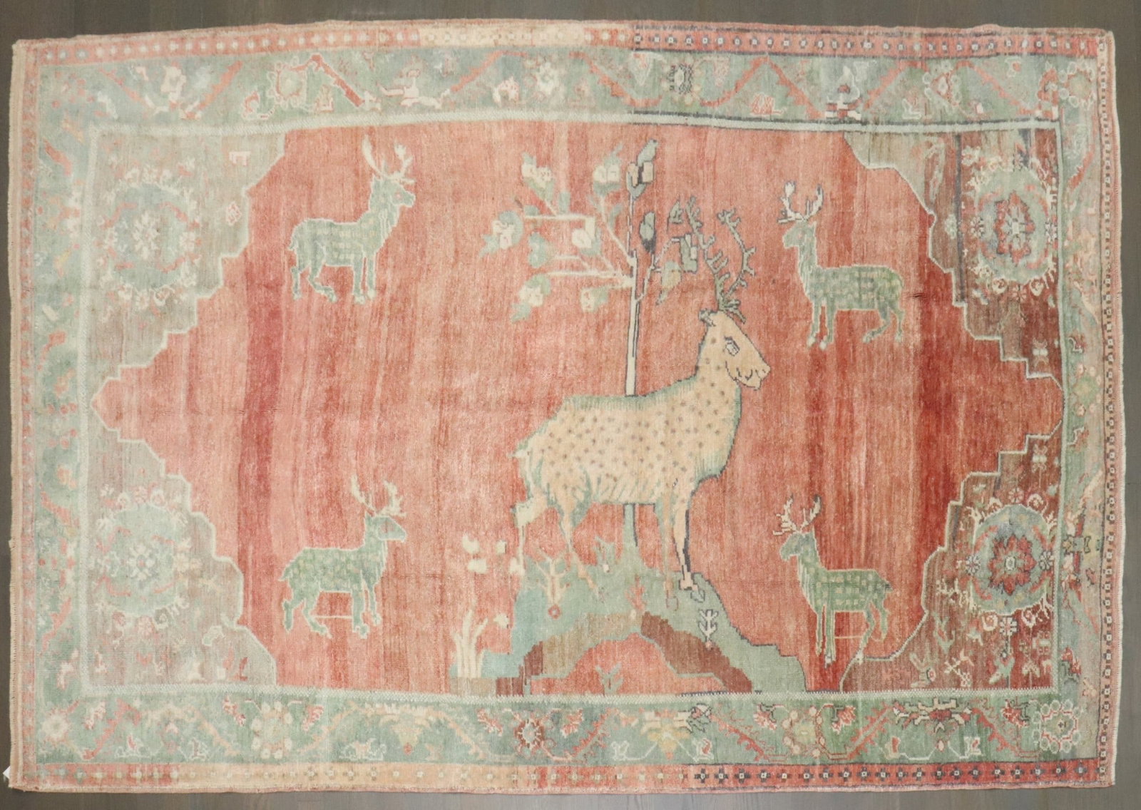 4' 11" x 7' 9" Konya Anatolian Pictorial Animal Motif Rug: 4' 11" x 7' 9" Konya Anatolian Pictorial Animal Motif Rug One-of-a-kind Turkish pictorial Konya rug featuring an animal motif with a central goat and surrounding deer. This mid-20th century Anatolian 