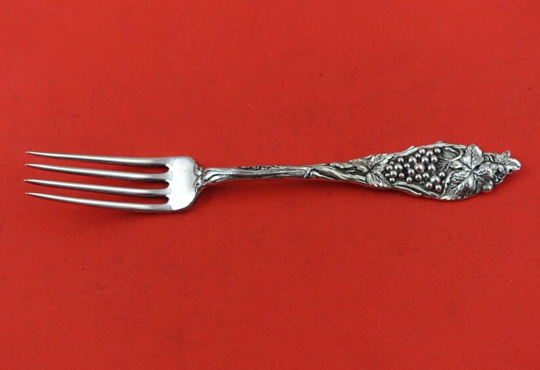 Watson Sterling Silver 7" Fruit Series Luncheon Fork with Grapes: Watson Sterling Silver 7" Fruit Series Luncheon Fork with Grapes Explore the elegance of this Fruit Series Luncheon Fork by Watson, crafted from high-quality sterling silver. The fork features a charm