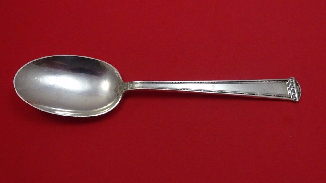 International Sterling Silver Serving Spoon Pantheon Pattern 8 1/4": International Sterling Silver Serving Spoon Pantheon Pattern 8 1/4" This exquisite serving spoon is crafted from high-quality sterling silver and features the Pantheon pattern by International. The de