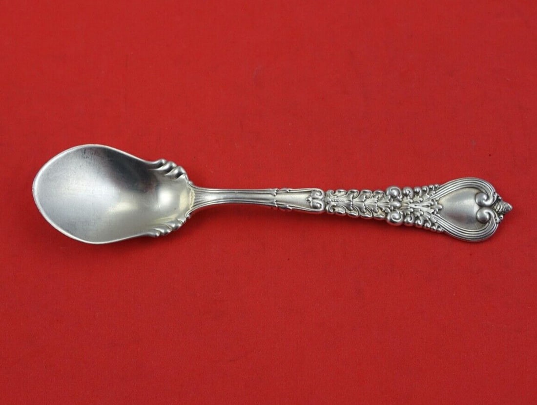 Tiffany & Co. Florentine Sterling Silver Ruffled Ice Cream Spoon 5 5/8": Tiffany & Co. Florentine Sterling Silver Ruffled Ice Cream Spoon 5 5/8" Indulge in the elegance of the Florentine pattern by Tiffany & Co. with this exquisite sterling silver ice cream spoon. Measurin