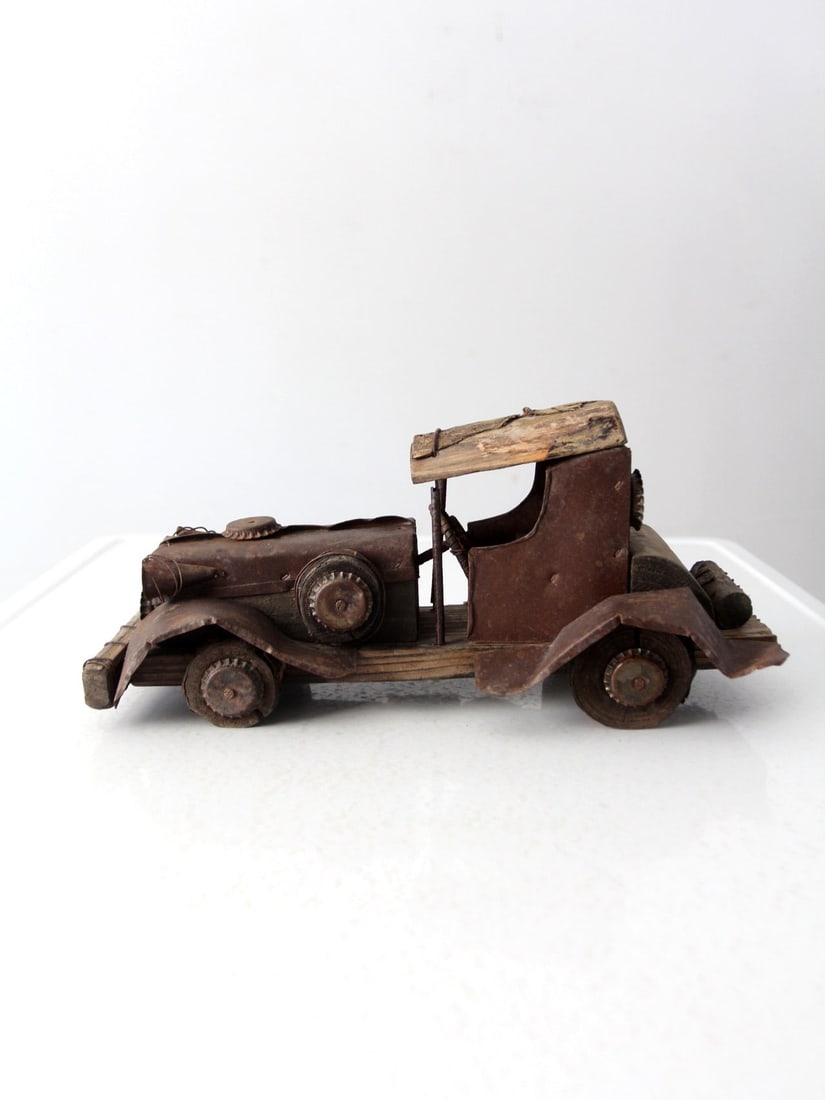 Vintage Handmade Rustic Folk Art Car 14 Inch Metal and Wood: Vintage Handmade Rustic Folk Art Car 14 Inch Metal and Wood This vintage handmade folk art car showcases rustic charm, modeled after early twentieth-century automobiles. The body is crafted from metal