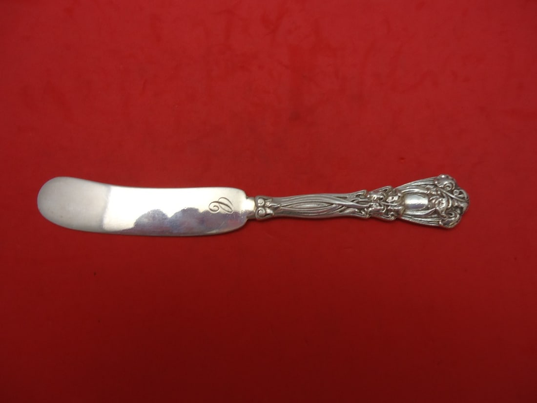 Durgin-Gorham Iris Sterling Silver 6 Inch Butter Spreader Knife: Durgin-Gorham Iris Sterling Silver 6 Inch Butter Spreader Knife This Iris butter spreader from Durgin-Gorham is crafted from high-quality sterling silver, featuring a wide flat handle design for easy 