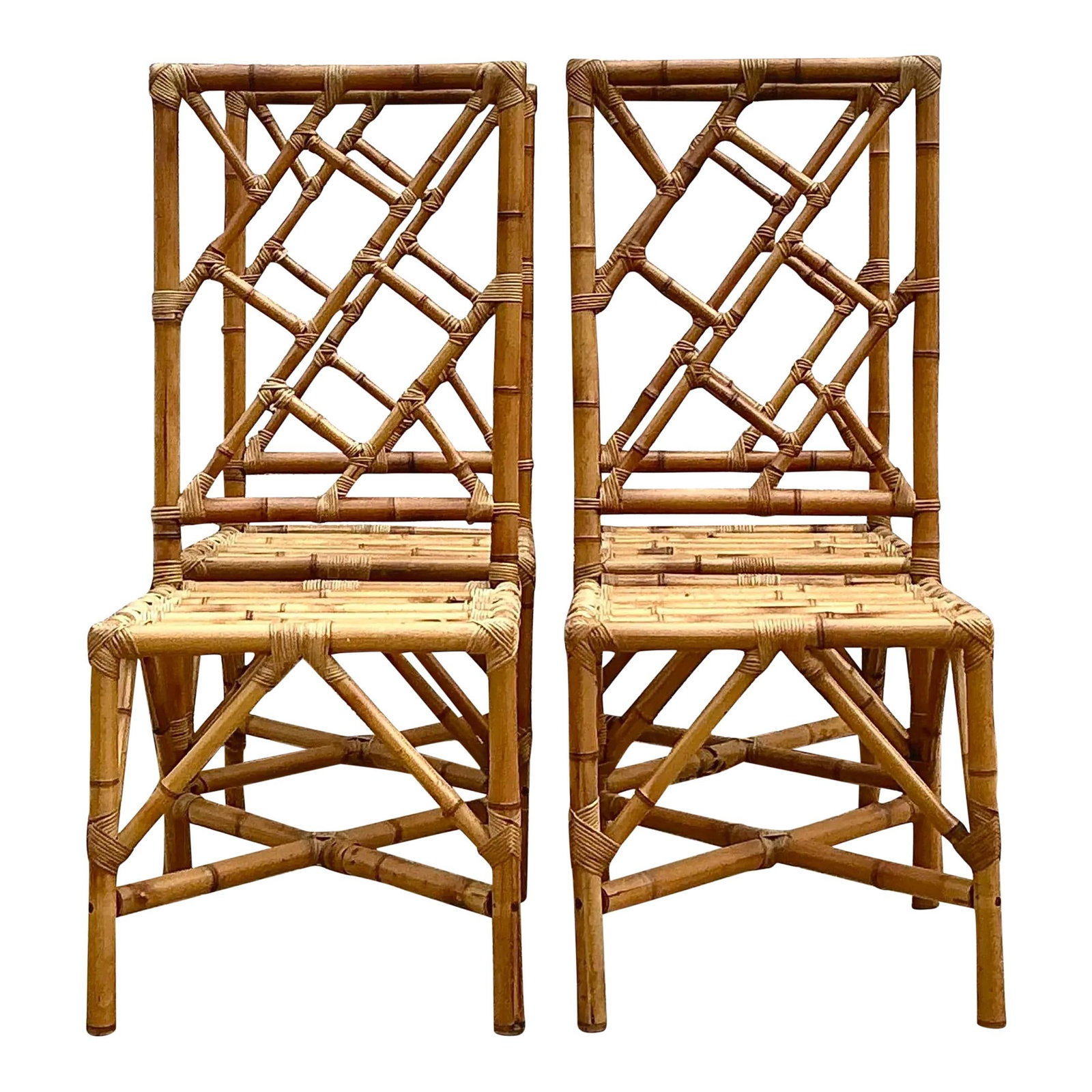 Set of 4 Vintage Chinese Chippendale Rattan Dining Chairs: Set of 4 Vintage Chinese Chippendale Rattan Dining Chairs Enhance your dining area with this exquisite set of four vintage Chinese Chippendale-style dining chairs. Made from natural rattan, these chai
