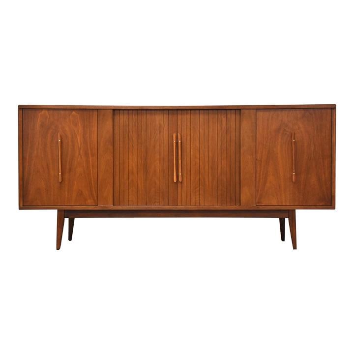 Mid Century Modern Walnut Credenza with Tambour Doors and Brass Accents: Mid Century Modern Walnut Credenza with Tambour Doors and Brass Accents This exquisite mid-century modern walnut credenza features elegant tambour doors, sculpted pulls, and stylish brass accents. Wit