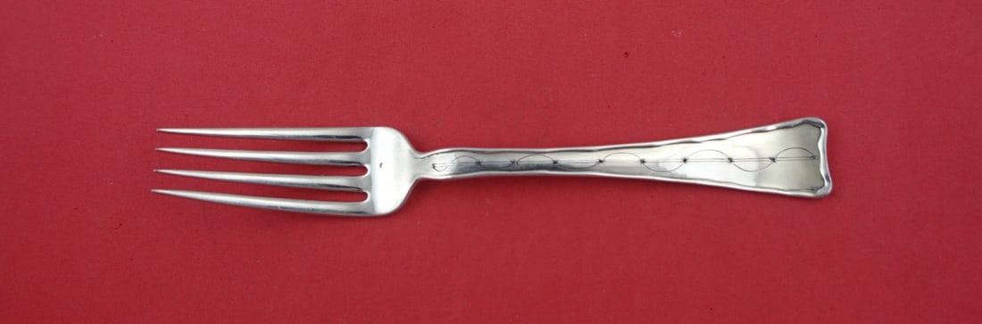 Tiffany & Co. Lap Over Edge Hand Engraved Sterling Silver Dinner Fork 8": Tiffany & Co. Lap Over Edge Hand Engraved Sterling Silver Dinner Fork 8" This exquisite dinner fork features the renowned Lap Over Edge Hand Engraved pattern by Tiffany & Co., showcasing elegant geome