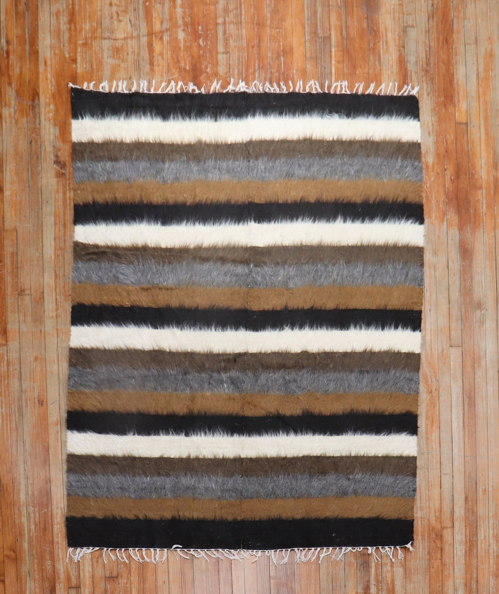 5' 3" x 6' 7" Turkish Mohair Accent Rug: 5' 3" x 6' 7" Turkish Mohair Accent Rug Late 20th century Turkish mohair rug with a striped design and fringed edges. This pre-owned accent rug offers a vintage look and is described as square in cate