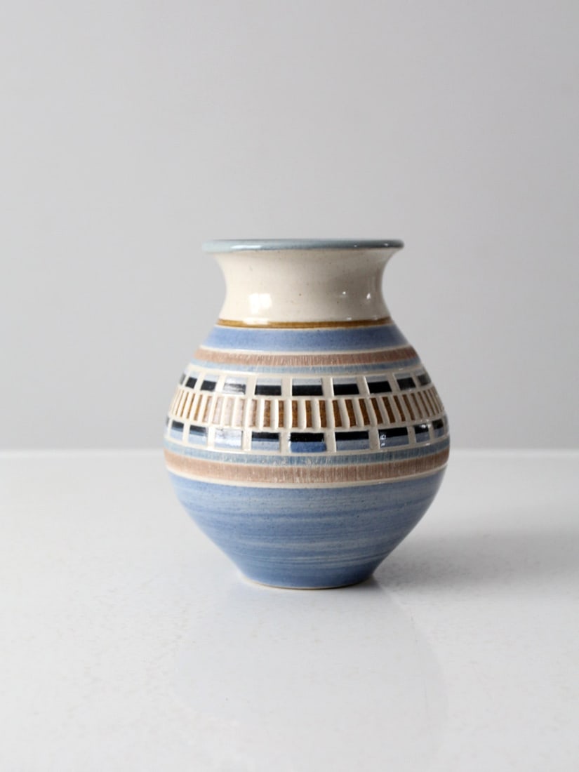 1992 Vintage Studio Pottery Vase Handmade Signed Relief Design: 1992 Vintage Studio Pottery Vase Handmade Signed Relief Design This vintage studio pottery vase, dated 1992, showcases a unique handmade design featuring a compelling raised relief stamp. The vase is 
